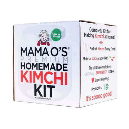 A box labeled Mama O’s Premium Homemade Kimchi Kit by Mama O’s Premium Kimchi. The kit highlights probiotic benefits, offers vegan kimchi options, and includes Original, Super Spicy, and Kosher varieties.